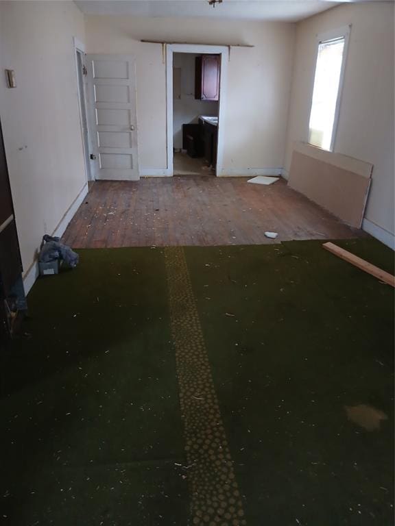 unfurnished bedroom featuring wood-type flooring