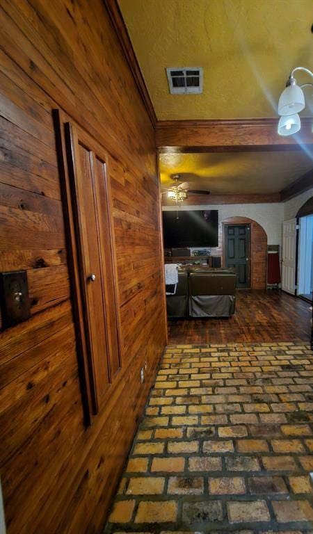 hallway with wooden walls