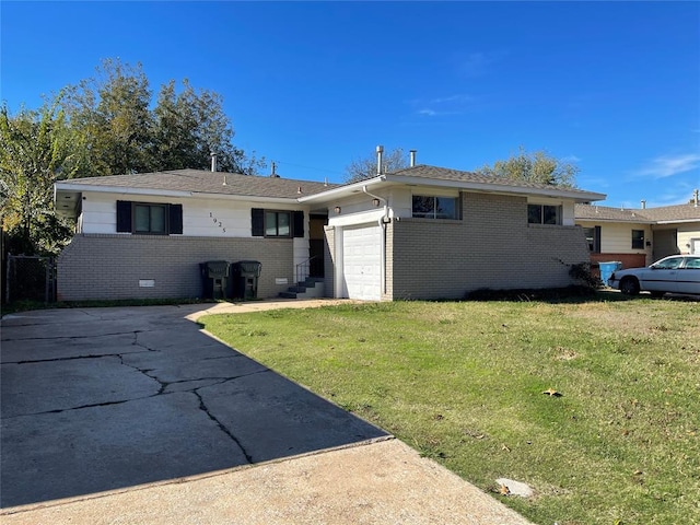 single story home with a garage and a front lawn