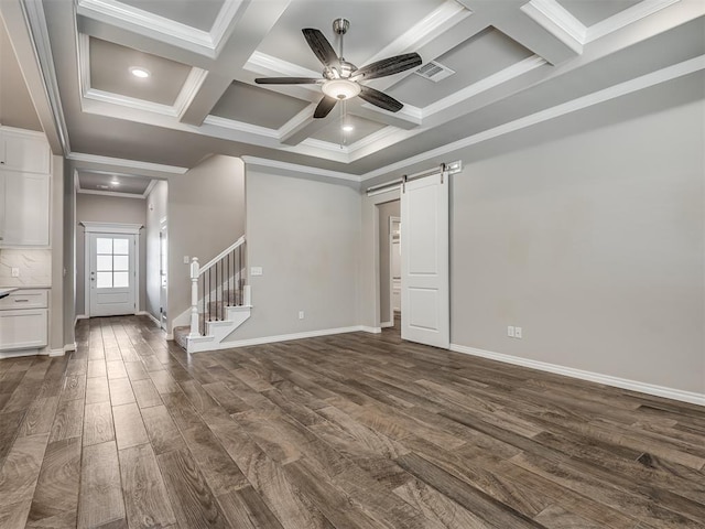 unfurnished room with coffered ceiling, crown molding, dark hardwood / wood-style floors, a barn door, and beamed ceiling