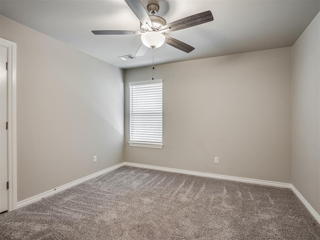 carpeted empty room featuring ceiling fan