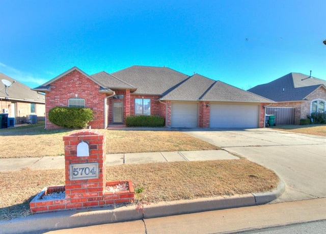 ranch-style home featuring a garage