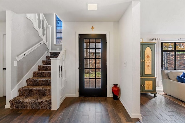 entryway with dark wood-type flooring