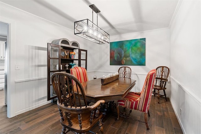 dining room with dark wood-type flooring and ornamental molding