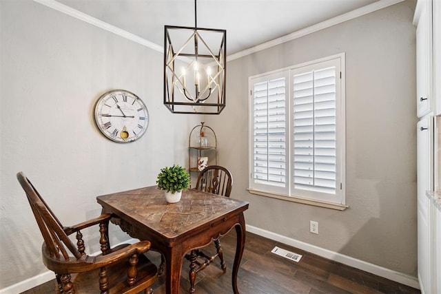 dining room featuring ornamental molding, an inviting chandelier, and dark wood-type flooring