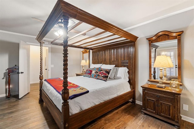 bedroom with hardwood / wood-style floors, ceiling fan, and ornamental molding