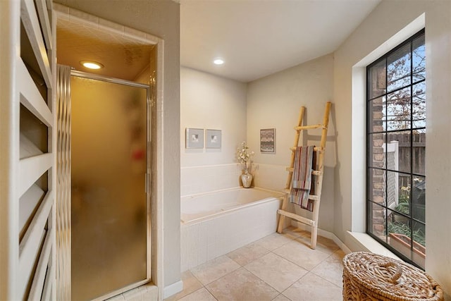 bathroom with tile patterned floors and plus walk in shower