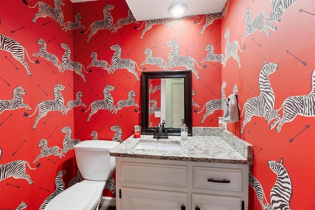 bathroom with vanity and toilet