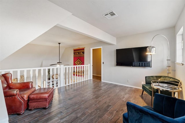 living area with hardwood / wood-style floors and ceiling fan