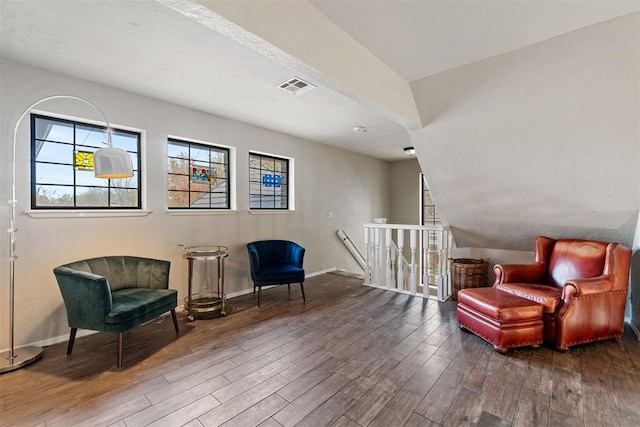 sitting room featuring dark wood-type flooring