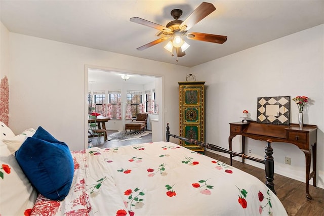 bedroom featuring ceiling fan and dark hardwood / wood-style flooring