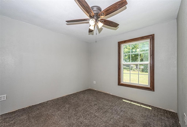 unfurnished room featuring carpet and ceiling fan