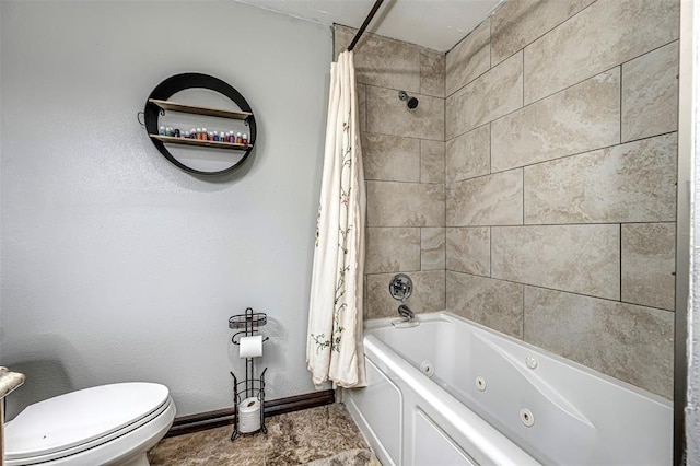 bathroom with shower / bath combination with curtain and toilet