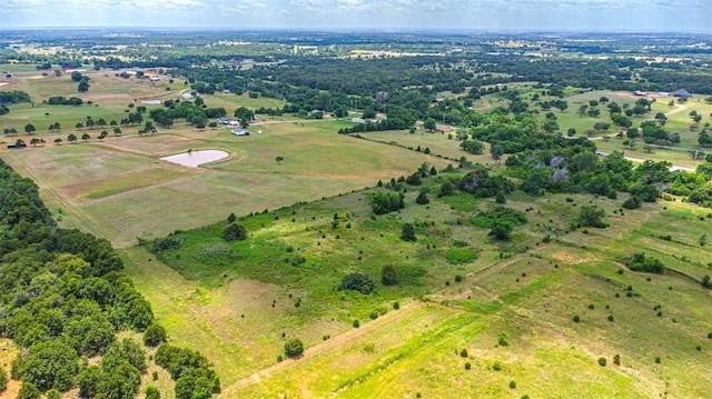 birds eye view of property featuring a rural view