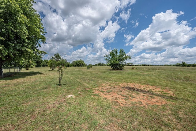 view of yard with a rural view