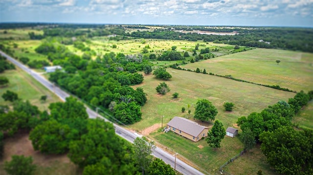 birds eye view of property featuring a rural view