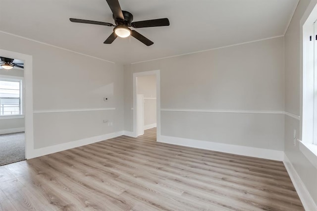 empty room featuring light hardwood / wood-style floors and ceiling fan