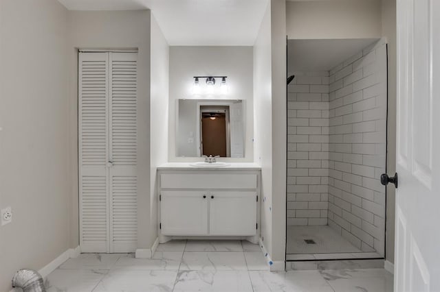 bathroom featuring vanity and a tile shower