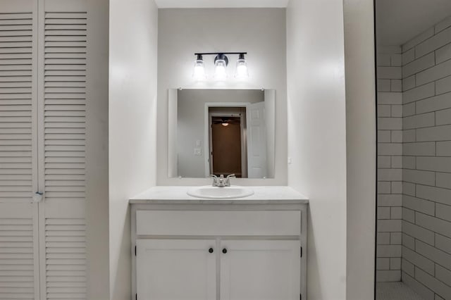 bathroom featuring ceiling fan and vanity