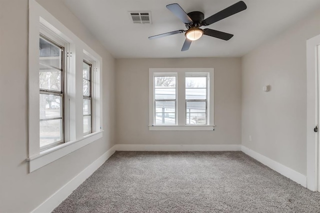 carpeted empty room with ceiling fan