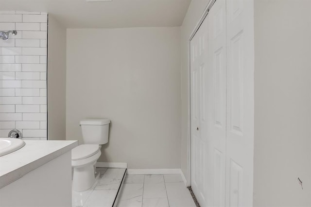 bathroom with toilet and vanity