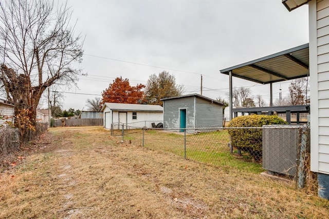 view of yard featuring cooling unit and an outdoor structure