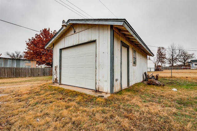 garage featuring a lawn