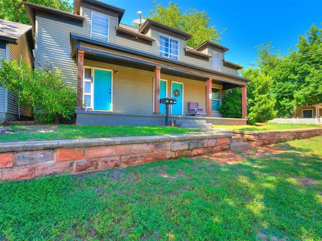 view of front of home featuring a porch and a front yard