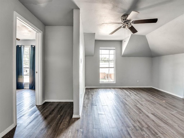 bonus room with dark hardwood / wood-style floors, ceiling fan, and lofted ceiling