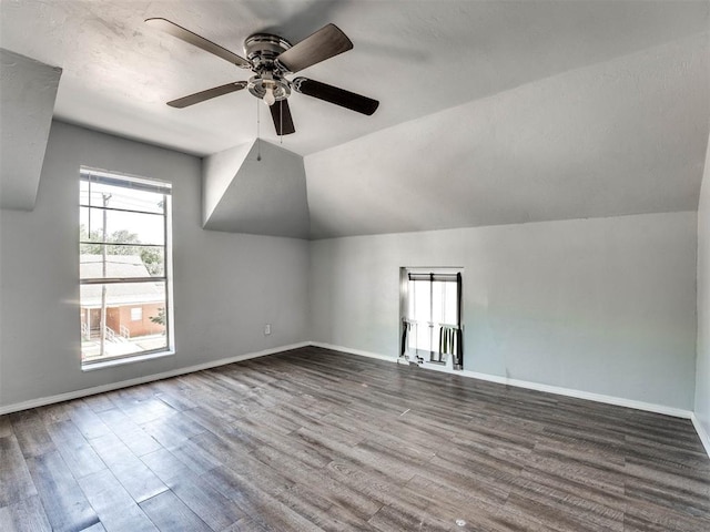 bonus room with hardwood / wood-style floors, ceiling fan, and lofted ceiling