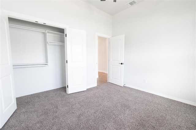 1817 Taines Turn, Norman, OK 73072 - unfurnished bedroom featuring carpet, baseboards, and a closet