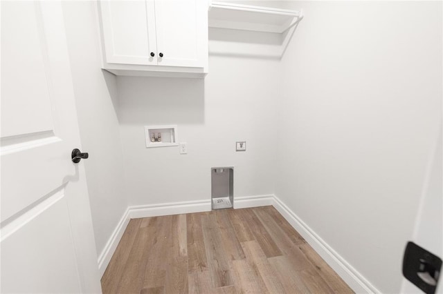 1817 Taines Turn, Norman, OK 73072 - laundry area featuring cabinet space, light wood-style floors, baseboards, and washer hookup