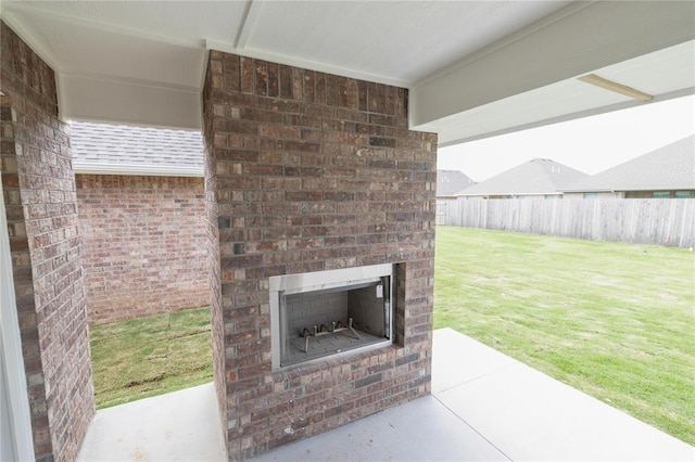1817 Taines Turn, Norman, OK 73072 - view of patio with an outdoor brick fireplace and fence