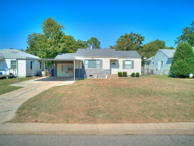 ranch-style house with a front yard and a carport