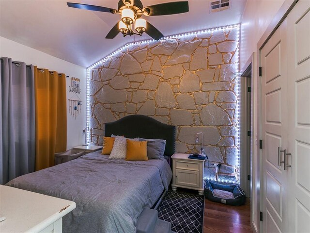 bedroom featuring vaulted ceiling, ceiling fan, and dark wood-type flooring