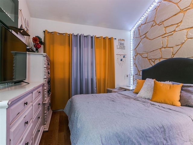 bedroom featuring dark hardwood / wood-style floors