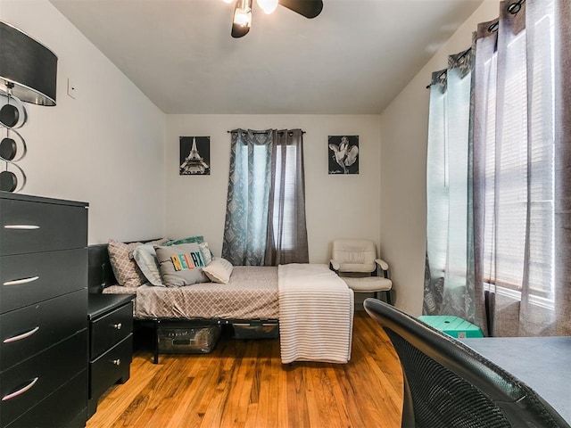 bedroom featuring light wood-type flooring and ceiling fan