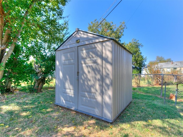 view of outbuilding featuring a yard