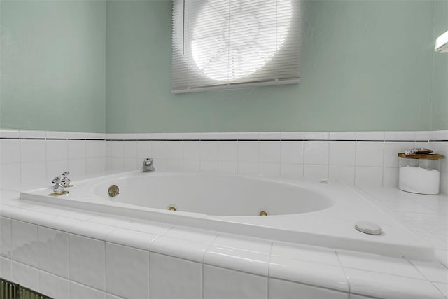 bathroom with tiled bath