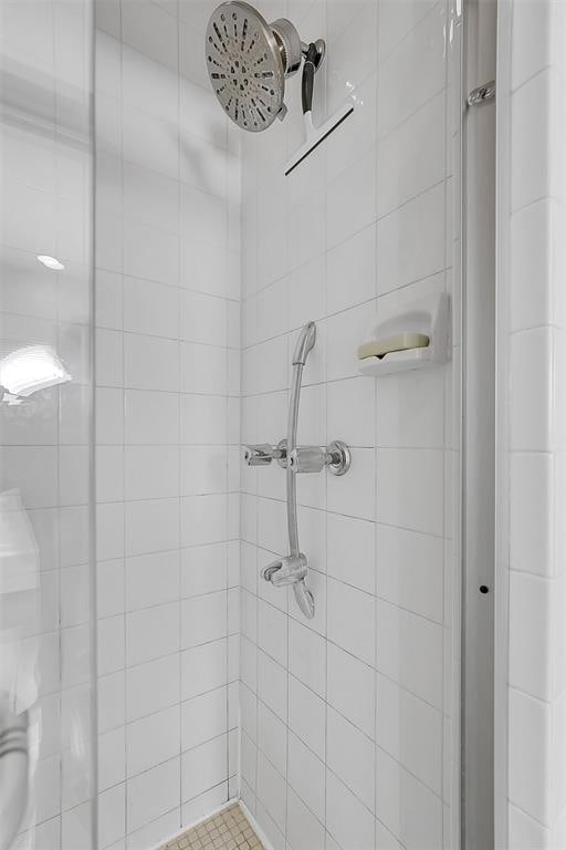 bathroom with a tile shower