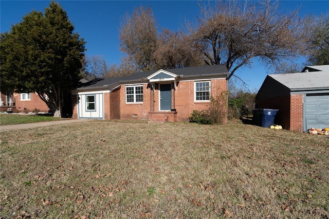 single story home featuring a garage and a front lawn