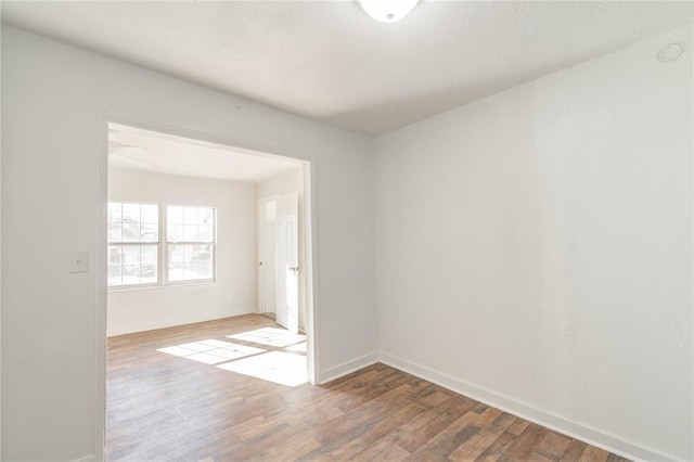 spare room with hardwood / wood-style floors