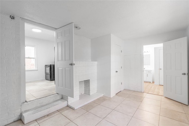 bathroom featuring tile patterned floors and a fireplace