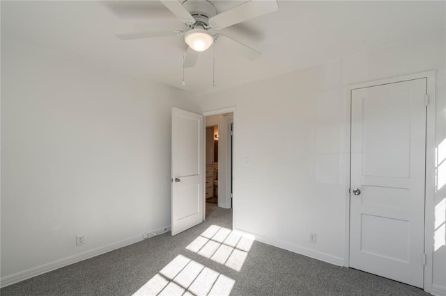 empty room with carpet flooring and ceiling fan