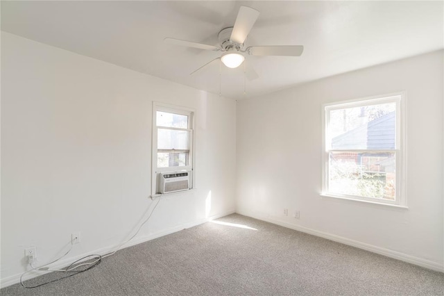 unfurnished room with carpet floors, cooling unit, and ceiling fan