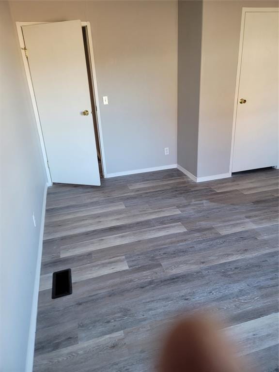 spare room featuring hardwood / wood-style floors