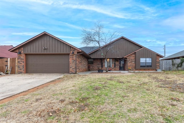 single story home featuring a front lawn and a garage