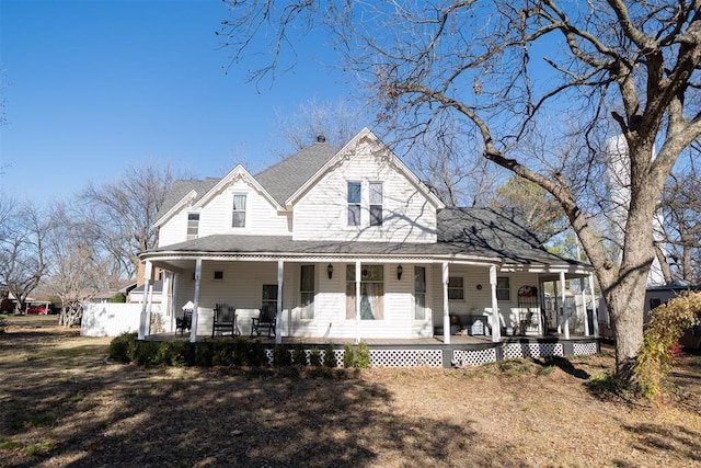 country-style home featuring covered porch