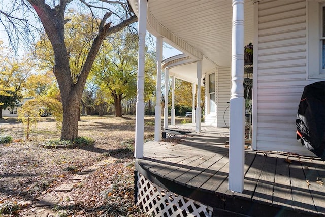 wooden terrace featuring covered porch