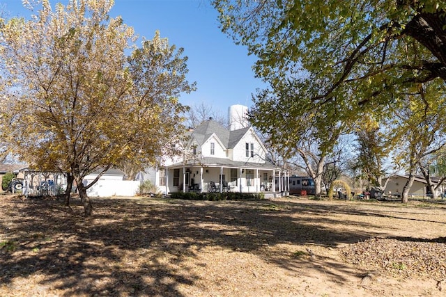 farmhouse-style home featuring covered porch